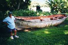 Betty VP6YL infront of an old longboat