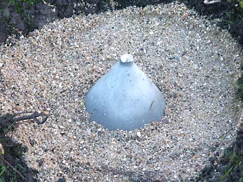 Showing concrete antenna base on its bed of sharp sand