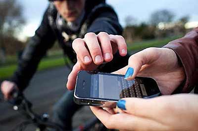 A mobile phone being snatched.