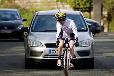 A cyclist holding up traffic.