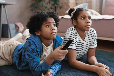 Kids watching the telly.