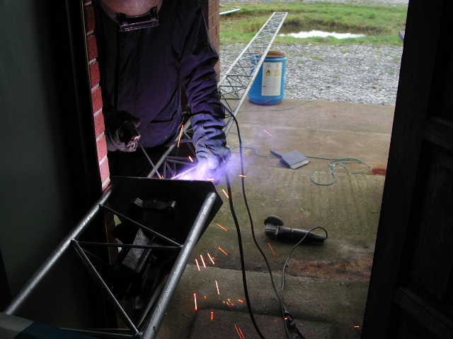 welding cage to top section