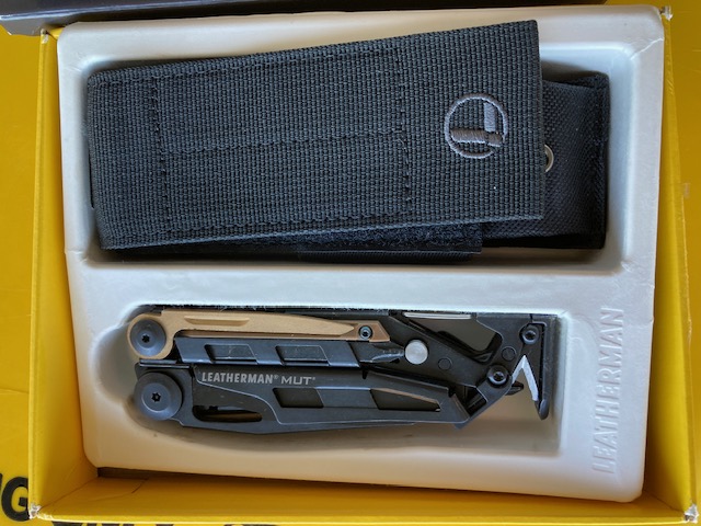 Leatherman MUT multi-tool in original box with belt case.