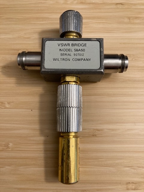 Wiltron 58A50 Autotester (VSWR Bridge) + 28A50-1 50 Ohm APC-7 Termination. Autotester has APC-7 test port with N-Female RF In and RF Out ports.
