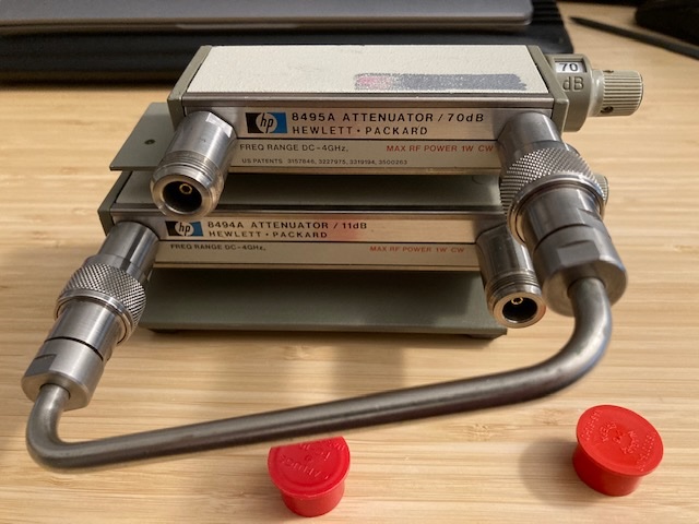 Photo of HP/Agilent Attenuator Set 8495A OPT 001, 8494A OPT 001, 11716A. DC-4GHz, 0-70 dB and 0-11 dB settings with interconnect cable and stand. N-Female connectors.