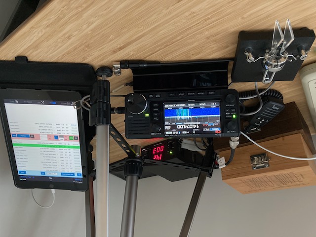 Photo of Icom IC-705 radio, with iPad running SDR-Control app and morse key paddles along side.