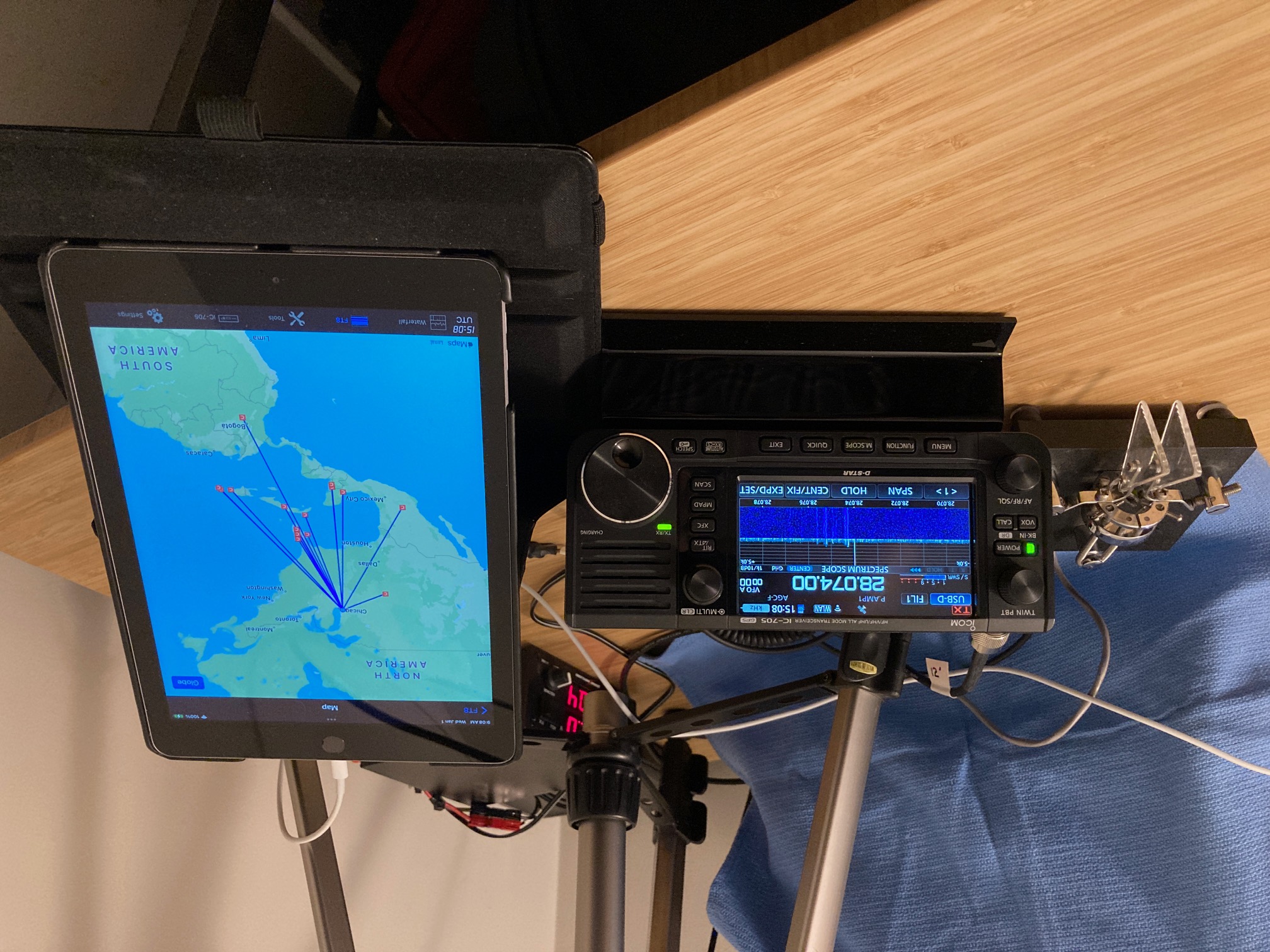 Desktop photo of an ICOM IC-705 transceiver with Bencher paddles and iPad running SDR-Control app.