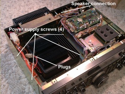 765 with top cover removed, showing location of speaker connection, 4 power supply screws, 
and power supply connectors.