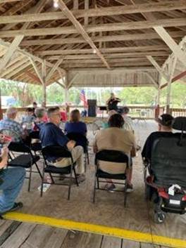 A group of people sitting in chairs

AI-generated content may be incorrect.