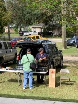A person standing next to a table with a table and chairs

AI-generated content may be incorrect.