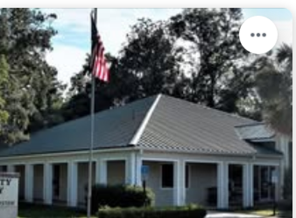 A building with a flag on the roof

AI-generated content may be incorrect.