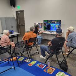 A group of men sitting in chairs

AI-generated content may be incorrect.