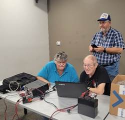 A group of people sitting in chairs

AI-generated content may be incorrect.