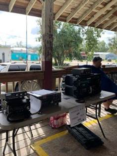 A table with several electronic devices on it

Description automatically generated