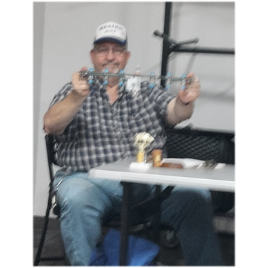 A person sitting at a table
Description automatically generated