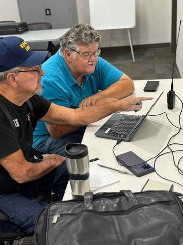 A person working on a table

Description automatically generated