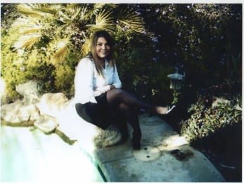 Wife sitting on a rock poseing, love nylons and heels!